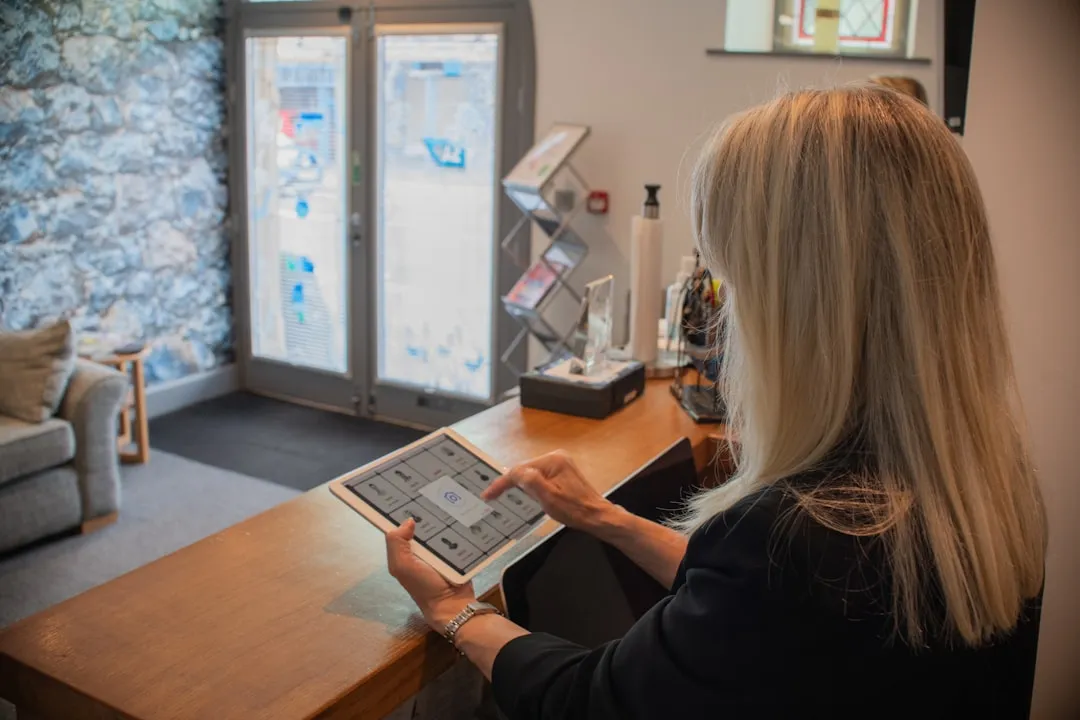 Modern office reception area with tablet and digital technology