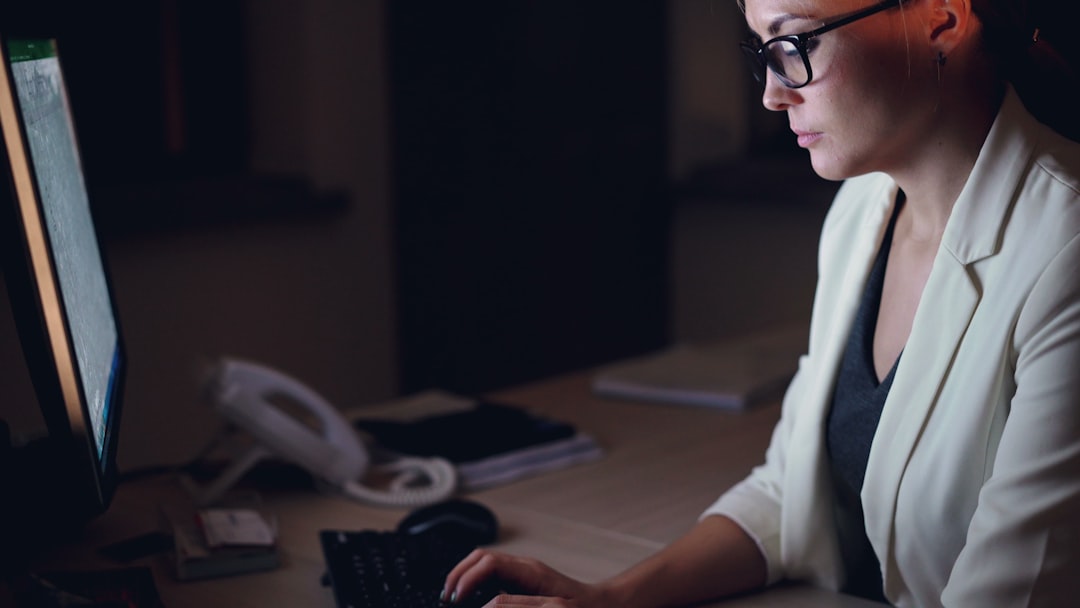 Professional answering service operator working at a desk during a night shift