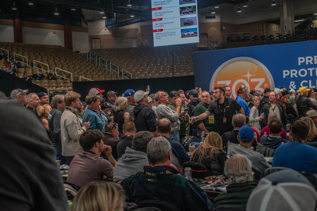 Community event with people seated in a warm indoor venue during a seminar