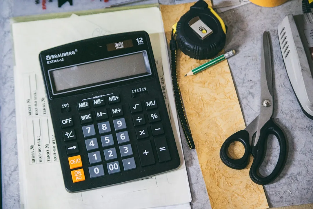 Business plan document with financial projections spread across a professional desk
