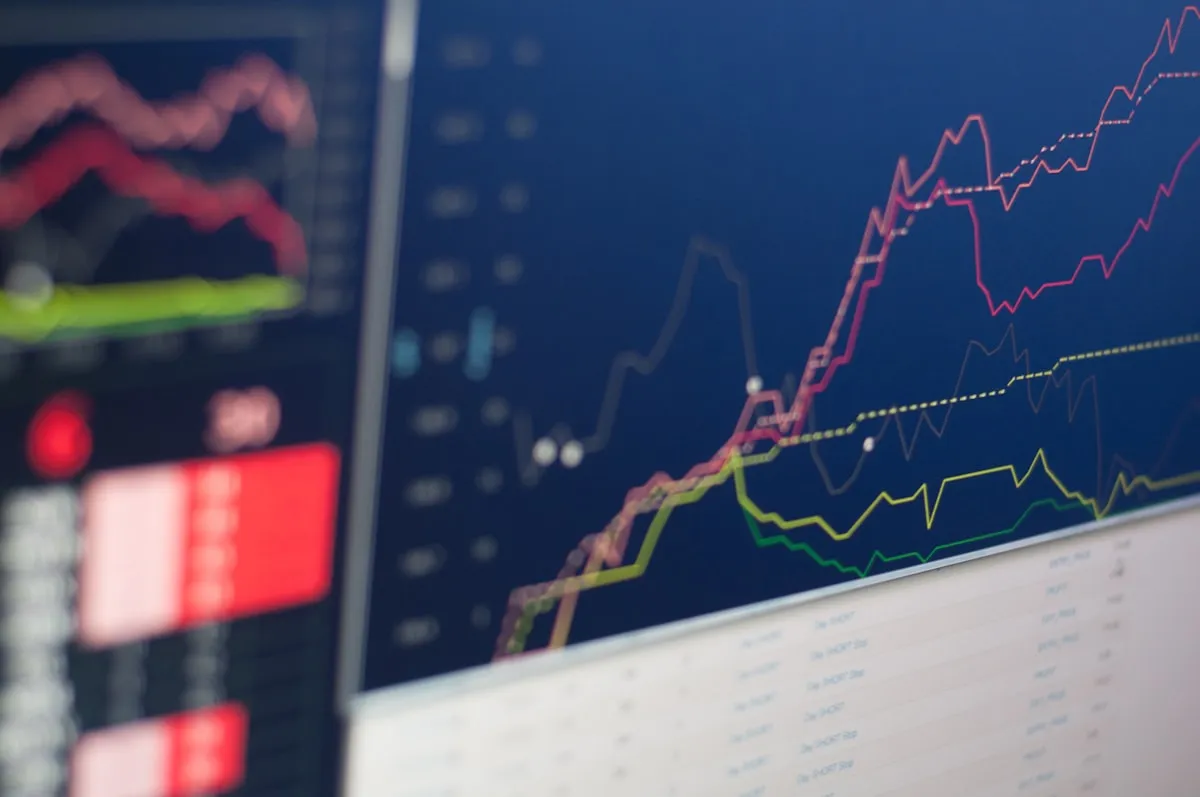 Market analysis data and charts on a professional desk