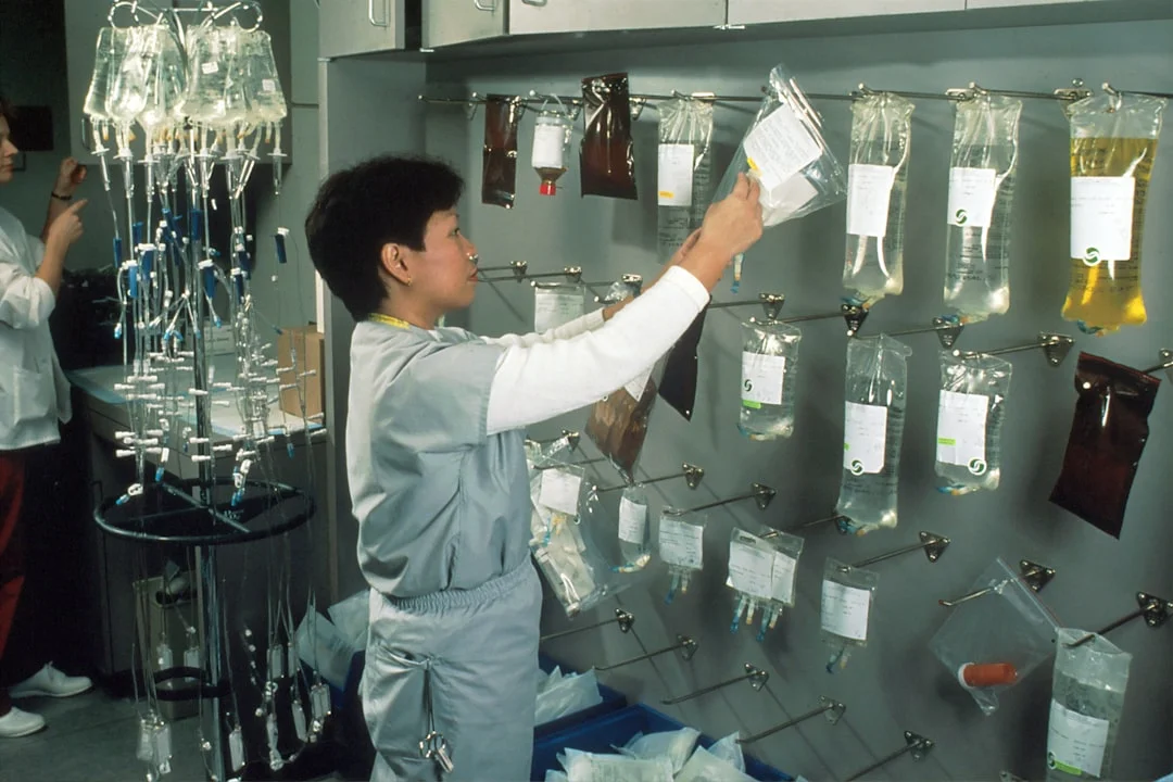 Organized chemical storage and safety equipment in a professional setting