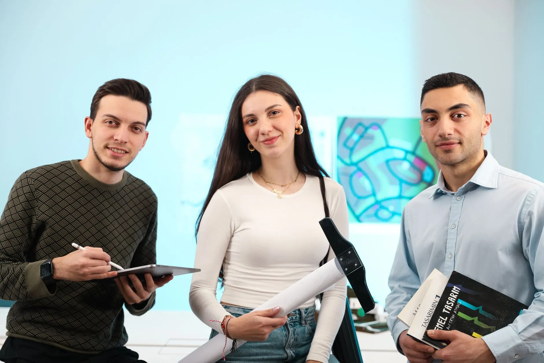 Diverse young adults collaborating together in a modern workspace