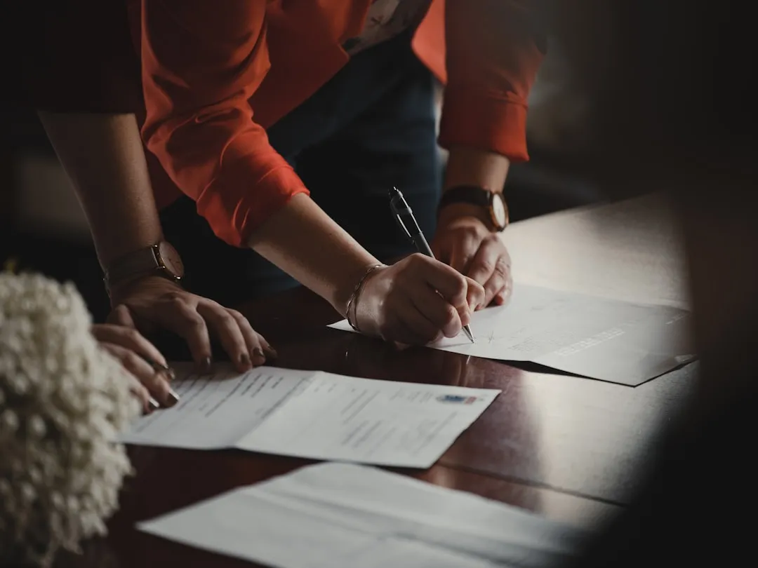 M&A attorney reviewing acquisition documents