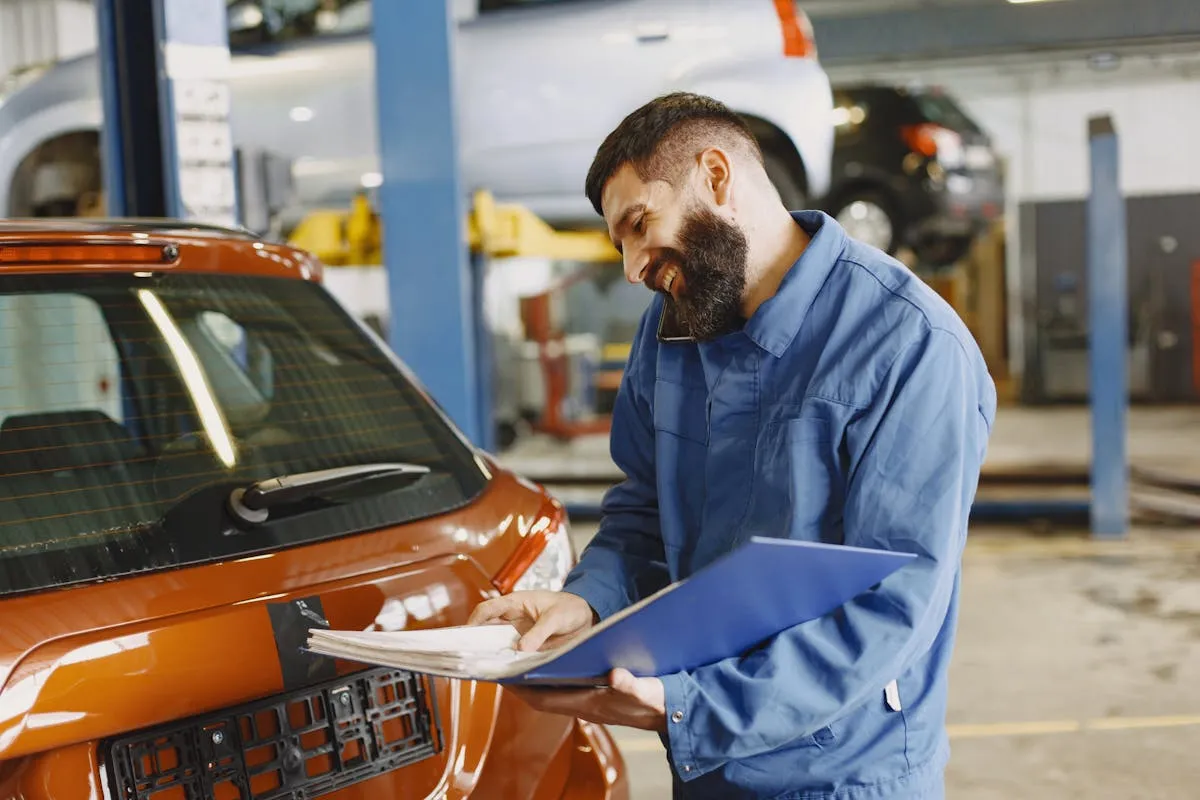 Mechanic performing fleet maintenance inspection on a commercial vehicle