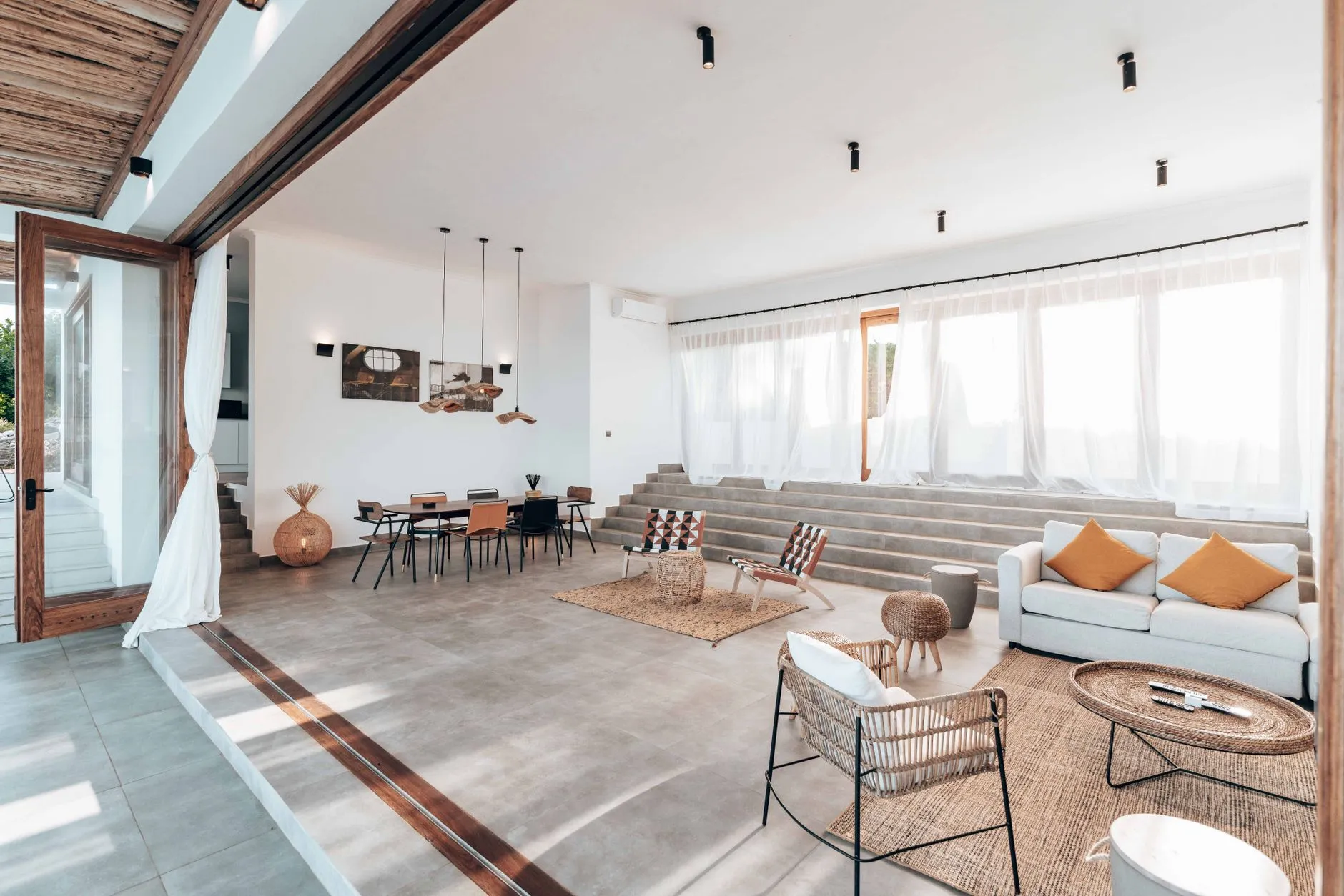 Modern bright interior space with flexible furniture and warm natural lighting