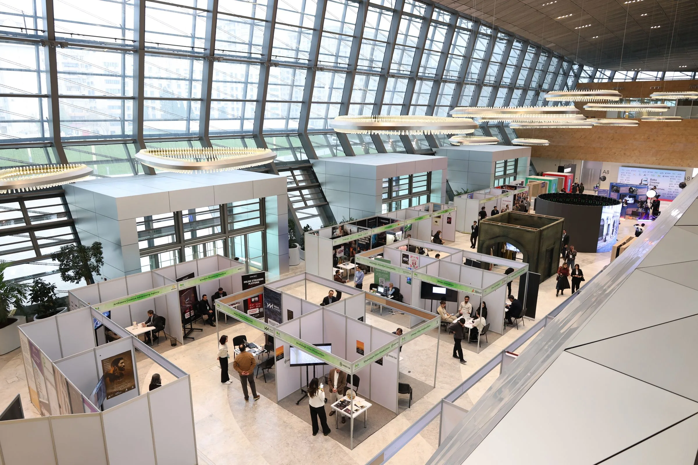 Professional trade show convention exhibition hall floor with exhibitor booths